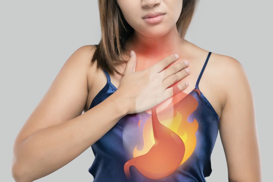 A person with her hand on her chest