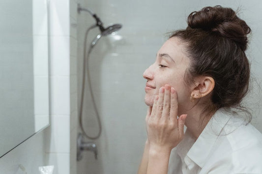 A person touching her face