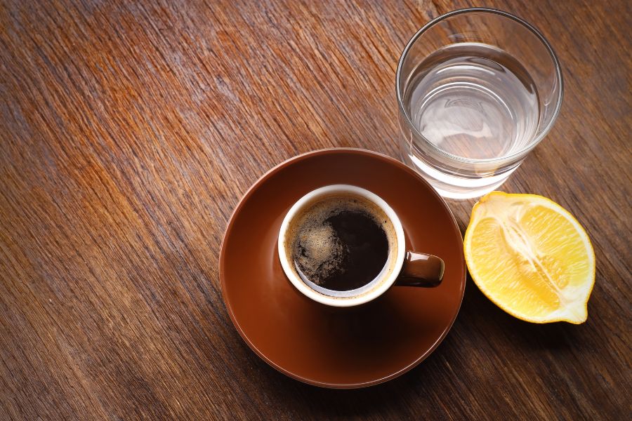A cup of coffee and a glass of water